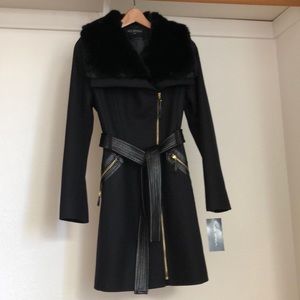 Unworn wool blend winter coat, faux fur collar, faux leather details.